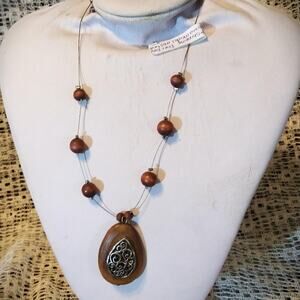 Tear drop shaped etched metal abstract